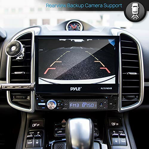 Car dashboard with rearview camera support display.